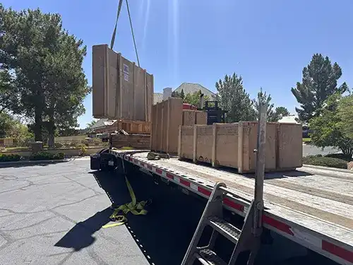 Fine art sculpture being carefully loaded and crated