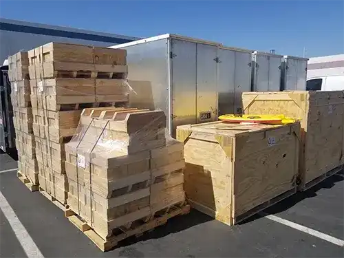 Loading dock with a truck being loaded with crated freight